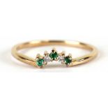 A 9ct gold emerald and diamond wishbone ring, approx UK size 'N'.