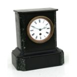 A Victorian black slate mantle clock, the white enamel dial with Roman numerals, 23cms (9ins) wide.