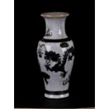 A Chinese crackle ware vase decorated in relief with dragons chasing a flaming pearl, with incised