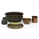 A Jewish brass bowl with repousse decoration depicting birds and Hebrew calligraphy; together with