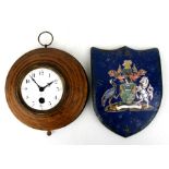 A late 19th century wall clock, the white enamel dial with Arabic numerals, in a faux wooden tin