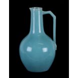 A Christopher Dresser design turquoise glaze jug, 27cms (10.25ins) high.Condition Report Crazing