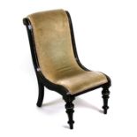 A Victorian upholstered nursing chair with ebonised frame.