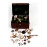 A quantity of vintage costume jewellery to include pendants, necklaces and brooches in a leather