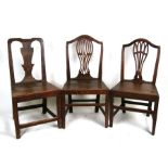 A George III oak dining chair with pierced back splat, solid seat and square tapering legs; together