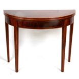 An Edwardian mahogany D-end card table with boxwood stringing, on square tapering legs, 92cms (