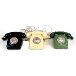 A vintage retro two-tone green dial telephone; together with two similar telephones (3).