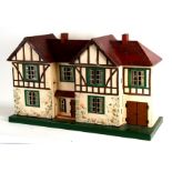 A 1930's mock Tudor two storey dolls house. 85cm ( 33.55 ins) wideCondition Reportgeneral wear for