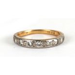 An 18ct gold diamond half eternity ring, approx UK size 'K', 2g.