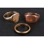 Two 9ct gold signet rings and a 9ct gold wedding band, weight 7g.