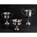 Three silver two-handled presentation cups, all with presentation inscriptions, London 1933,