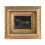 A bronzed composition plaque depicting a spaniel, in an ornate frame, 15 by 20cms (6 by 8ins)