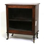 A Victorian faux rosewood display cabinet with single glazed door, on turned feet, 65cms (25.5ins)