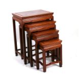 A nest of four graduated Chinese hardwood tables. Largest 48.5cm (19.5 ins) wide