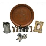 A Jonnie Walker style copper tray, 34cms (13.5ins) diameter; together with a spelter dog with lift-