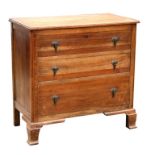 An early 20th century oak chest of three long graduated drawers, 83cms (32.5ins) wide.