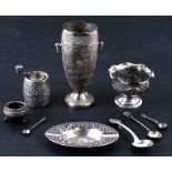 A quantity of Indian and Eastern silverwares including a pepper grinder, vases and spoons etc