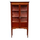 An Edwardian inlaid mahogany two-door glazed display cabinet, on square tapering legs and spade