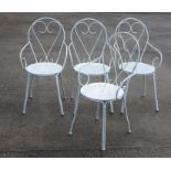 A set of four painted wire work scroll garden chairs (4).
