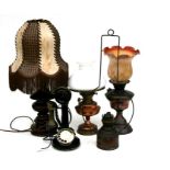 A group of oil lamps and table lamps; together with a brass candlestick telephone.
