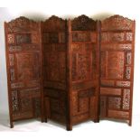 A four-fold pierced Indian hardwood screen, 204cms (80ins) wide when opened.