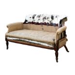 A late 19th century scroll arm upholstered sofa with turned front legs and original casters,
