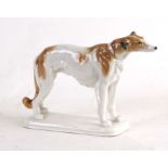A Karl Ens porcelain figure of a standing Borzoi, 16cms (6.25ins) high.Condition ReportGood