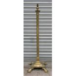 A Victorian brass Corinthian column telescopic standard lamp on a stepped square base with lion's