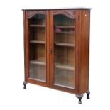 A late 19th century walnut two-door glazed display cabinet, on dwarf cabriole legs, 111cms (43.5ins)