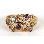 A 9ct gold ring set with multi coloured stones, approx UK size 'T', 4.1g.