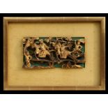 A Chinese gilt carved wood panel depicting a battle scene, framed, 23cms (9ins) wide.