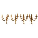 A set of four gilt brass twin-arm wall lights, 36cms (14ins) high (4).Condition Reportgood overall