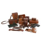 An Edwardian tooled leather three-division card case, 22cms (9ins) wide; leather binocular case;