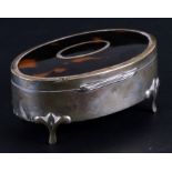 A silver and tortoiseshell oval dressing table box, Birmingham 1923, 10cms (4ins) wide.Condition