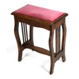 An Edwardian piano stool with lyre shaped supports, 47cms (18.5ins) wide.