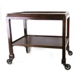 A Chinese hardwood (possibly Padouk) two-tier hostess trolley, 56cms (22ins) wide.