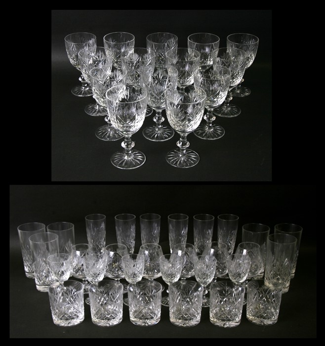 An extensive suite of Edinburgh Crystal Iona pattern cut glass glasses to include wine glasses,