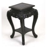 A late 19th / early 20th century ebonised two-tier Chinese plant stand, 36cms (14ins) wide.