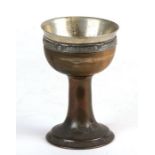 An Arts & Crafts Liberty style silver plate and turned wooden goblet, 13cms (5ins) high.Condition