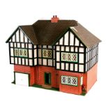A 1930's mock Tudor two storey dolls house. 78cm ( 30.5 ins) wide