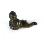 A Chinese bronze figure in the form of a crawling child, 7cms (3.5ins) wide.