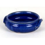 A Chinese monochrome blue two-handled brush washer, 15cms (6ins) diameter.