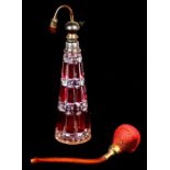 An early 20th century Baccarat cut and flashed glass perfume atomiser, 22cms (8.5ins) high.