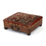 A Victorian rosewood foot warmer with boxwood stringing and embroidered top, 28cms (11ins) wide.