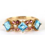 A 9ct gold dress ring set with pale blue and pink stones, approx UK size 'T', 3.2g.