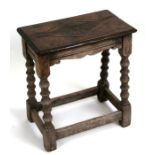 A 17th century style oak joint stool, 45cms (17.5ins) wide.