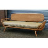 A mid 20th century Ercol blonde sofa daybed with beech frame, 181cms (71.25ins) wide.Condition