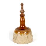 A salt glazed stoneware mallet shaped decanter decorated in relief with Masonic symbols, 37cms (14.