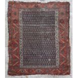 A Persian Mahal rug with all over design within floral borders on a red ground, 123 by 183cms (48 by