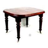 A Victorian mahogany dining table on turned legs, 100cms (39.5ins) wide.